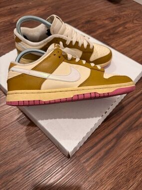 Nike Women's Dunk Low SE in the "Bronzine/Playful Pink"